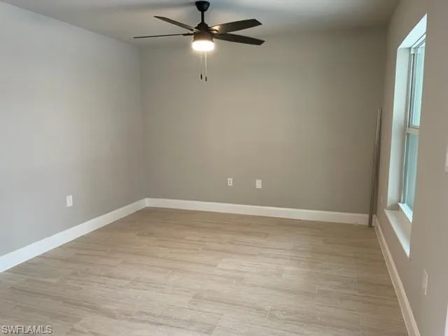 Spare room featuring light hardwood / wood-style flooring and ceiling fan