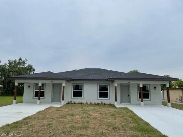 View of front of property with a front yard