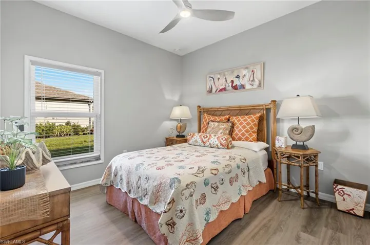 Bedroom featuring ceiling fan and hardwood / wood-style flooring