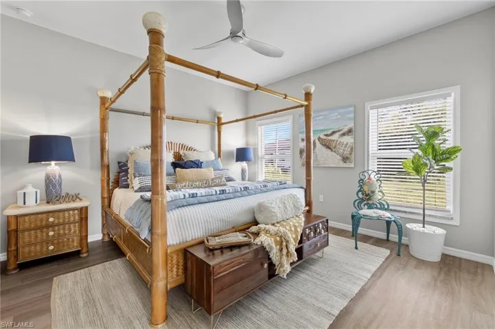 Bedroom featuring ceiling fan and hardwood / wood-style flooring