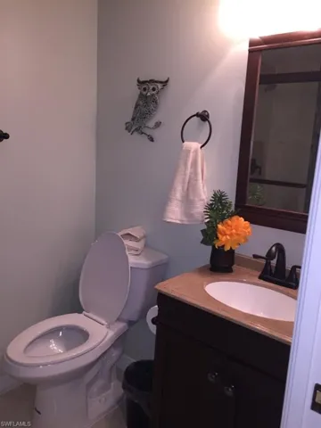 Half bath with vanity and toilet