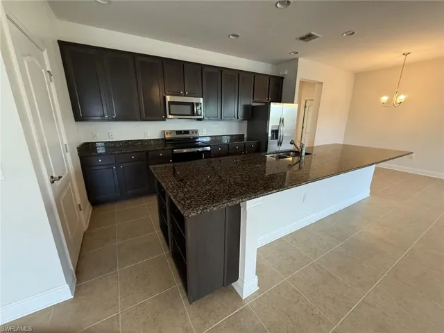 The kitchen has tons of storage, seating and shelving as well as a walk in pantry