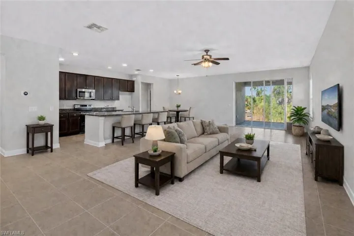 Virtually staged.   This open floorplan features a large living area and seating at the 12 foot kitchen island