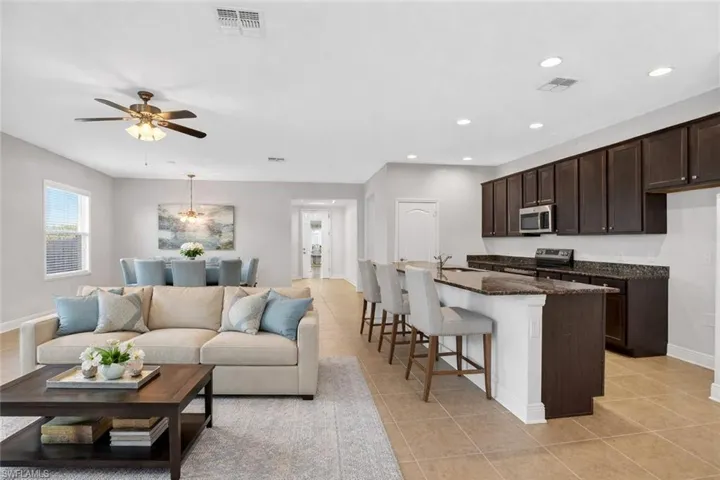 Virtually staged living, dining and kitchen