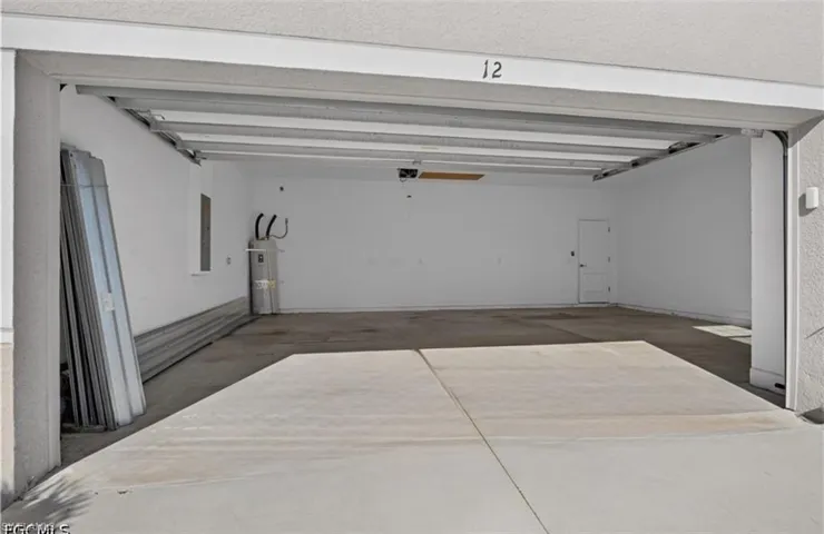 This is an oversized garage that will fit two vehicles along with another 1/2 space for storage or workbenches