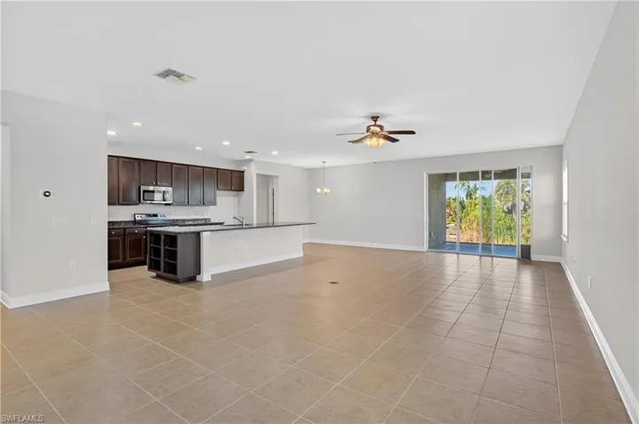 A view of the living room and kitchen from the formal dining room