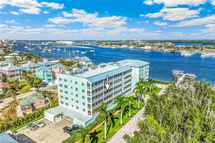 View of urban area featuring a large body of water and apartment complex