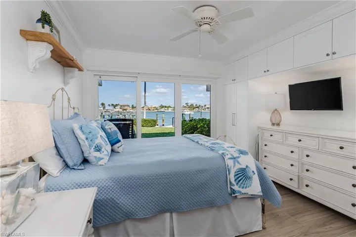 Bedroom featuring crown molding, ceiling fan, access to exterior, and light hardwood / wood-style floors