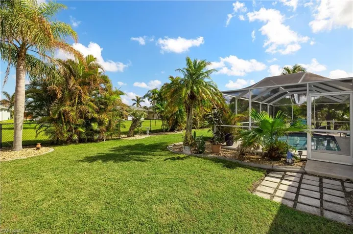 View of yard with a lanai