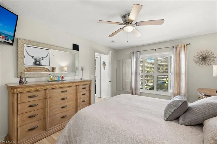 Bedroom featuring light hardwood / wood-style flooring and ceiling fan