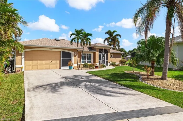 Single story home featuring a front lawn and a garage