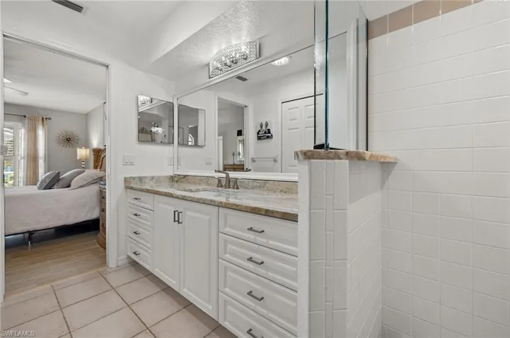 Bathroom with vanity and wood-type flooring