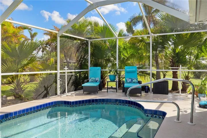 View of pool featuring a patio area and a lanai
