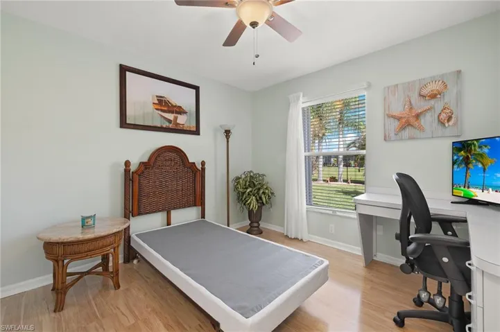 Bedroom with light wood-type flooring and ceiling fan