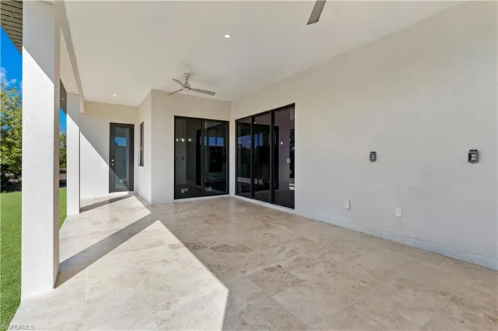 View of patio featuring ceiling fan