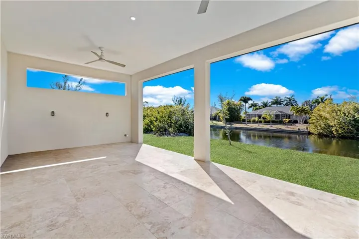 View of patio / terrace featuring a ceiling fan and a water view