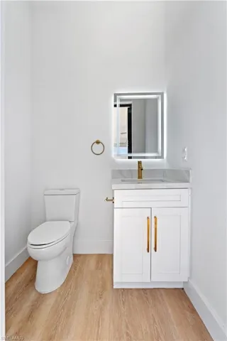 Bathroom featuring vanity and light wood-style floors