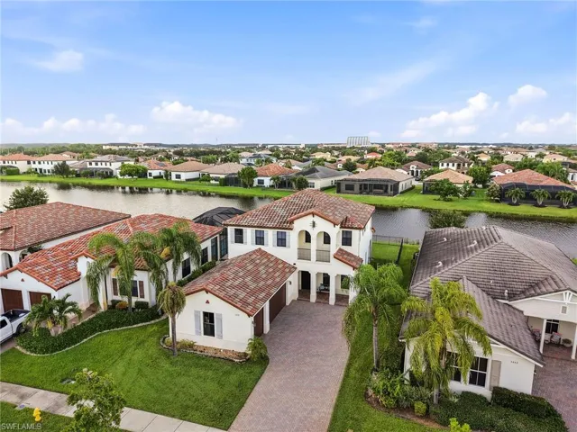 Mediterranean-inspired architecture with a two-story design and a detached garage