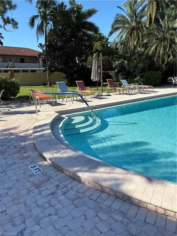 Community pool featuring a patio