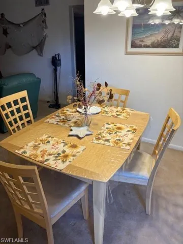 Dining area with a chandelier