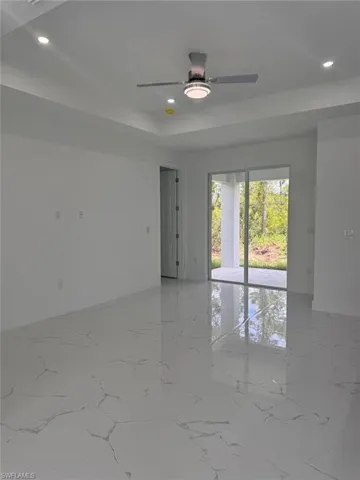 Spare room with ceiling fan