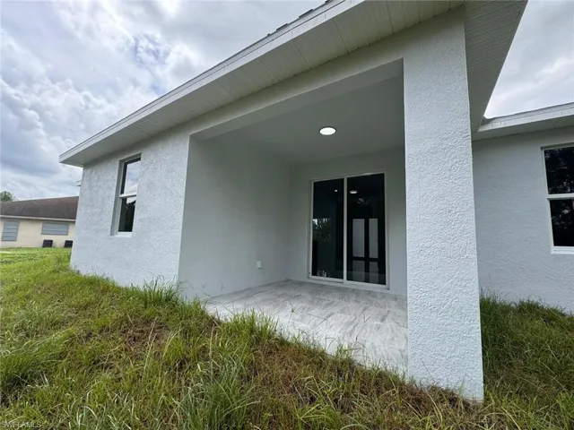 Rear view of property featuring a patio area
