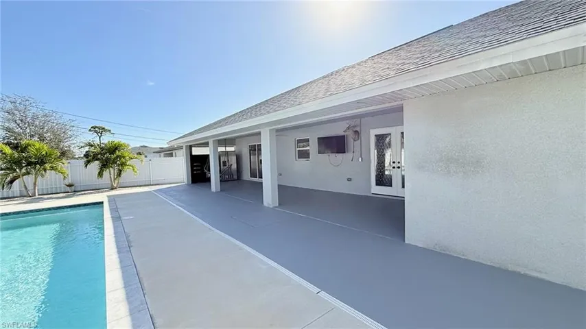 View of pool featuring a patio area and french doors