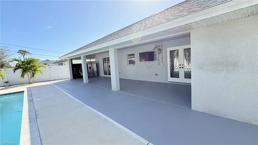View of swimming pool featuring a patio and french doors