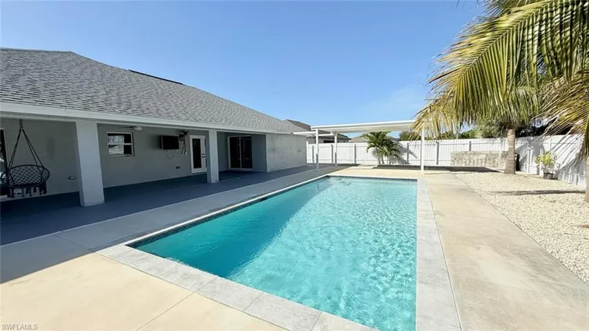 View of pool featuring a patio and a fenced backyard
