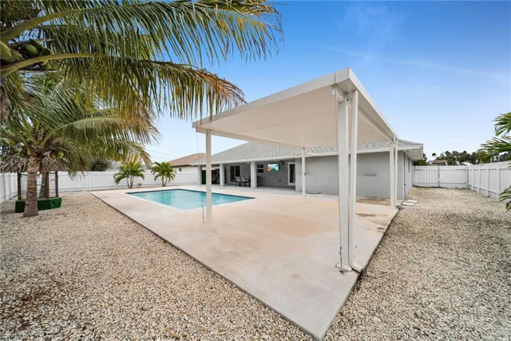 View of pool with a patio area and a fenced backyard