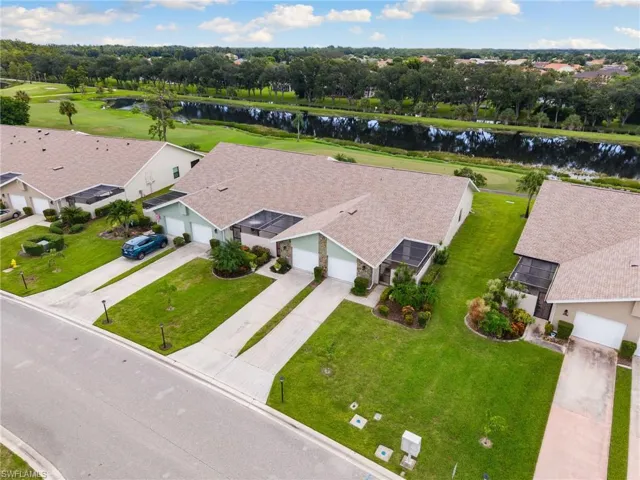 Corner unit with golf course and lake views