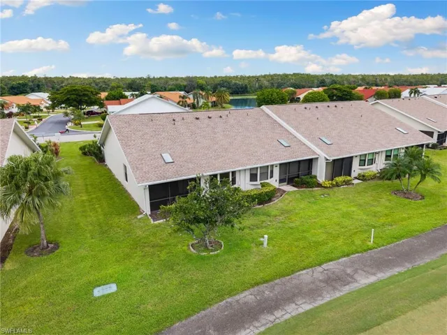 Corner unit with golf course and lake views