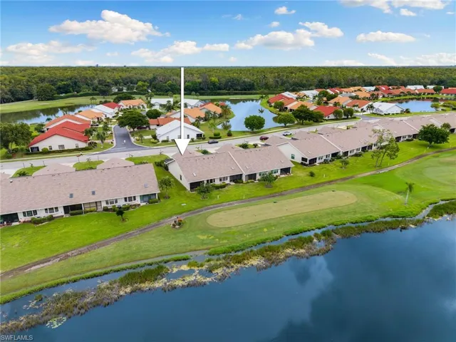 Corner unit with golf course and lake views