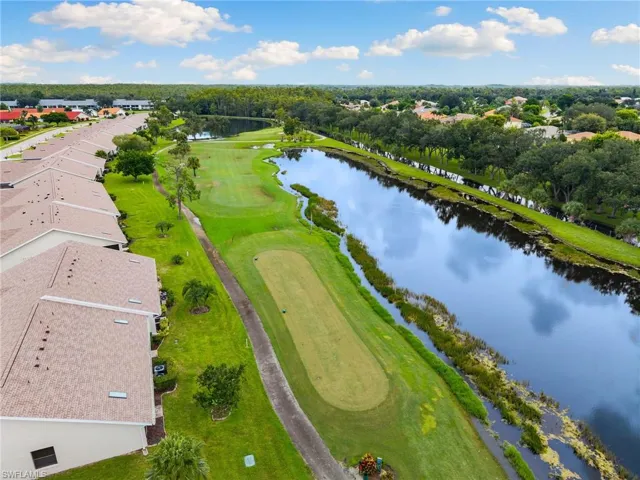 Corner unit with golf course and lake views