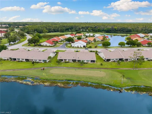 Corner unit with golf course and lake views