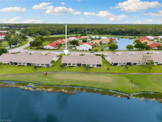 Corner unit with golf course and lake views