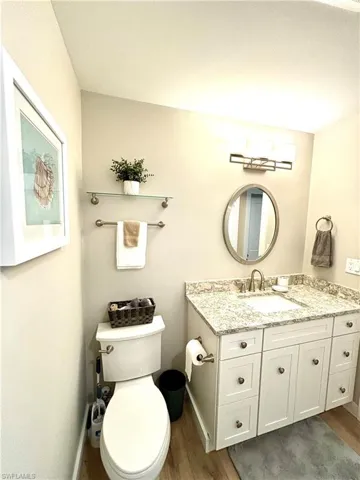 Bathroom 1 featuring wood style flooring and vanity