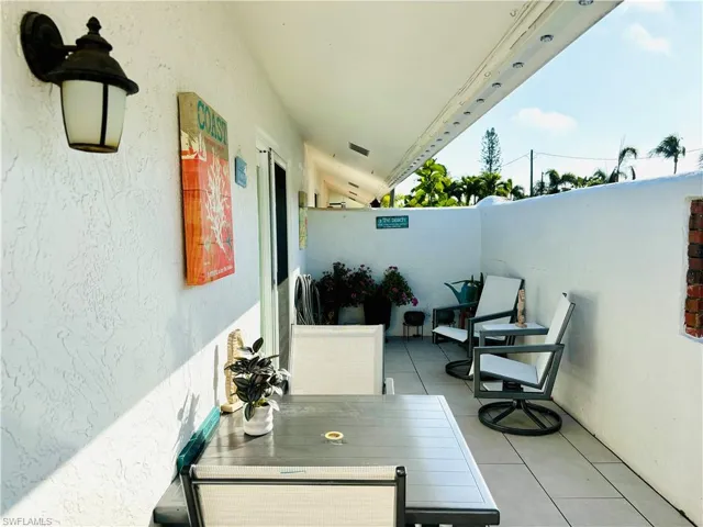 Sunny enclosed courtyard Patio, partially covered, perfect spot to relax or dine al fresco.
