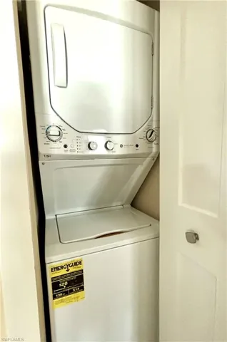 Laundry area with stacked washer / dryer