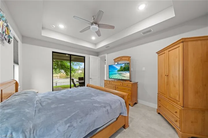 Bedroom featuring ceiling fan and concrete floors