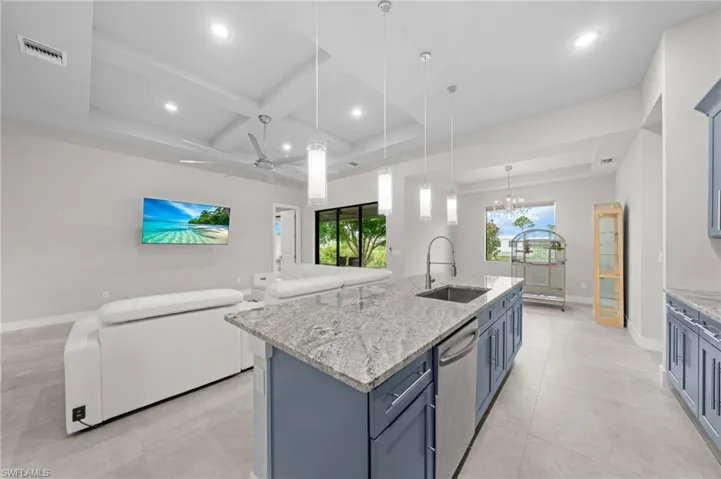 Dining space featuring a chandelier, recessed lighting, and concrete flooring