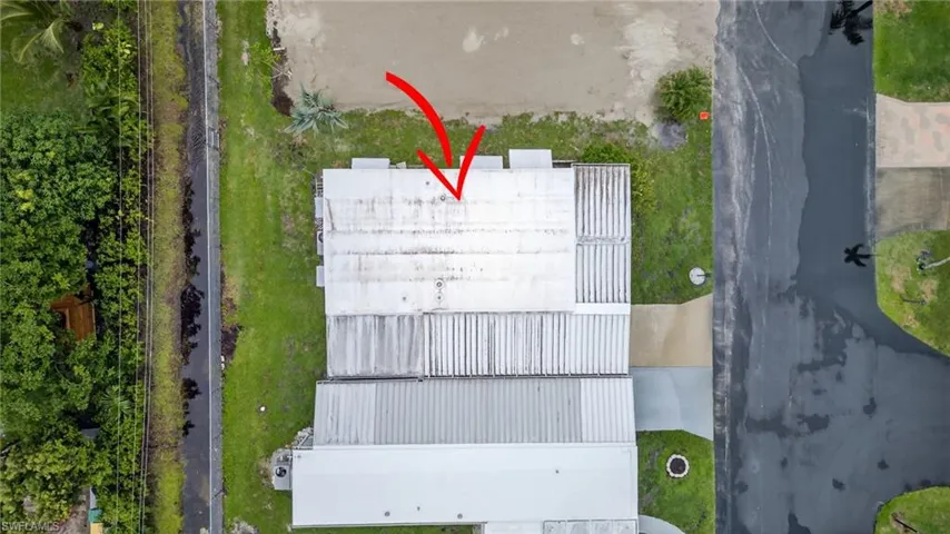 Drone / aerial view"New home coming soon next door."
