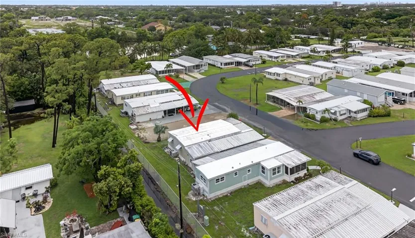 Drone / aerial view. "New home coming soon next door."