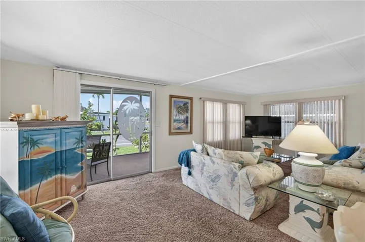Living room with plenty of natural light and carpet