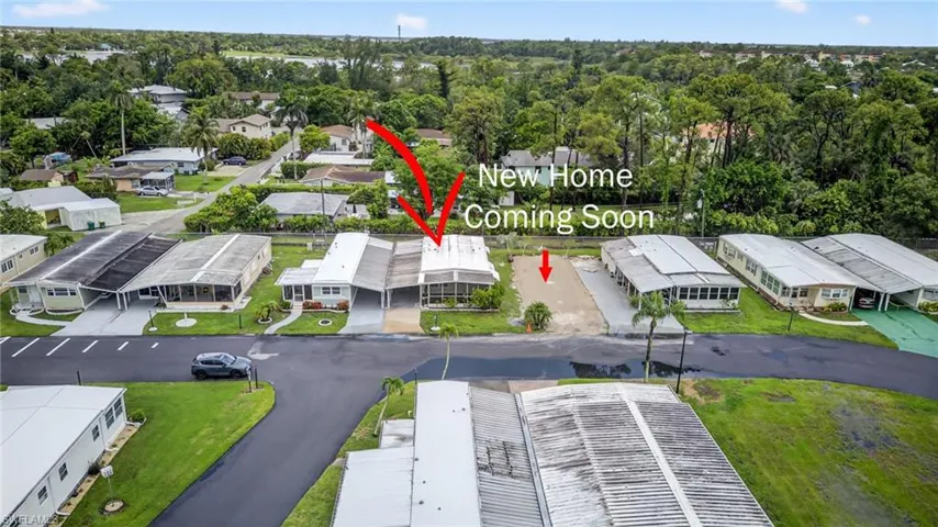 Aerial perspective.   "New home coming soon next door."
