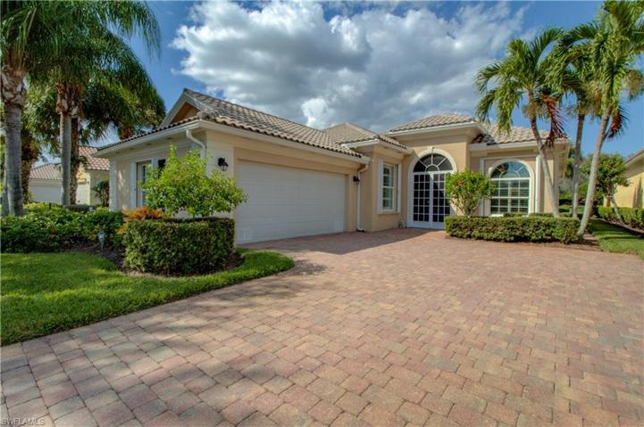 front of home. custom screened entry. hurricane shutters throughout