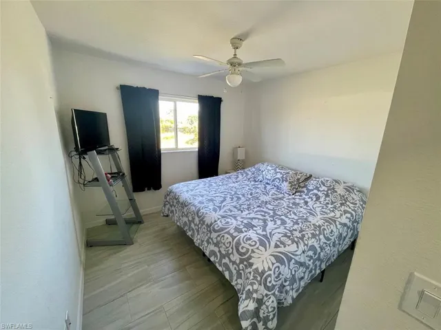 Bedroom featuring a ceiling fan and visible vents