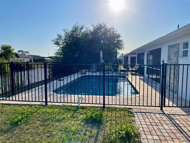 View of pool with a patio, fence, and a fenced in pool