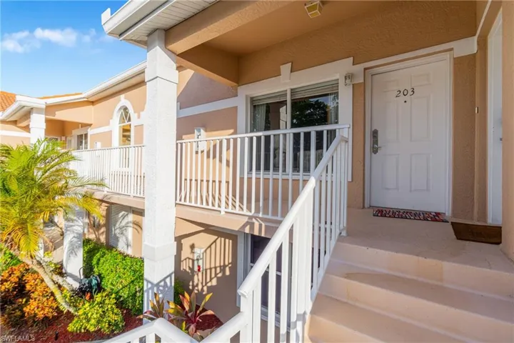 View of exterior entry featuring stucco siding