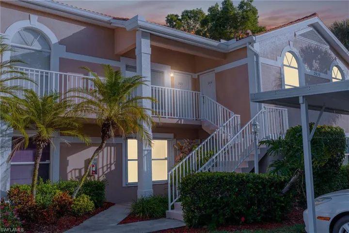 View of property with stairway